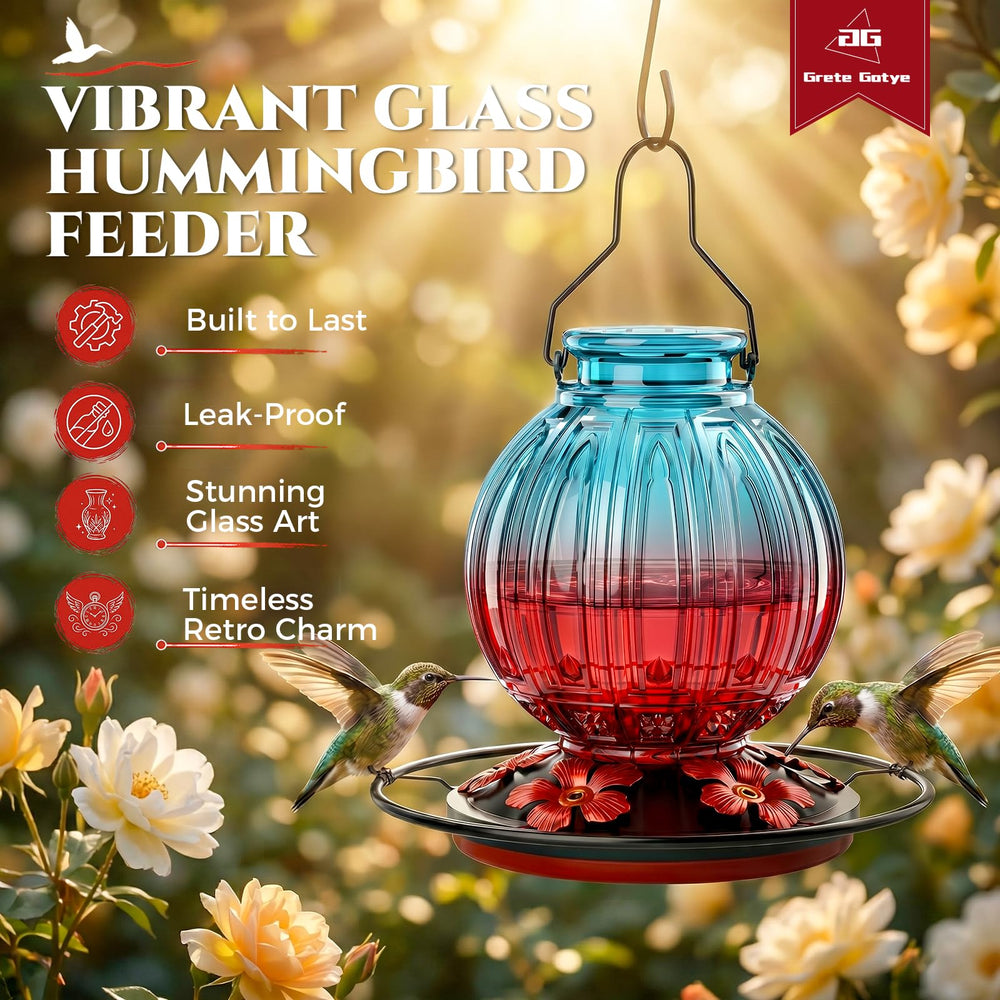 Grete Gotye hummingbird feeder with flowers in a garden
