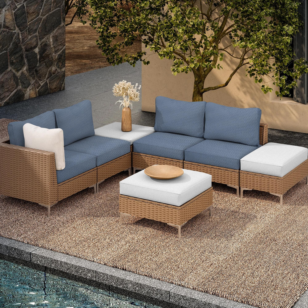 Grey blue DREAHOTEXTIL cushion covers in a garden setting