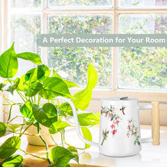 GUKJOB watering can displayed with indoor plants