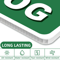 GXGGUS dog sign installed in a lawn with vibrant greenery