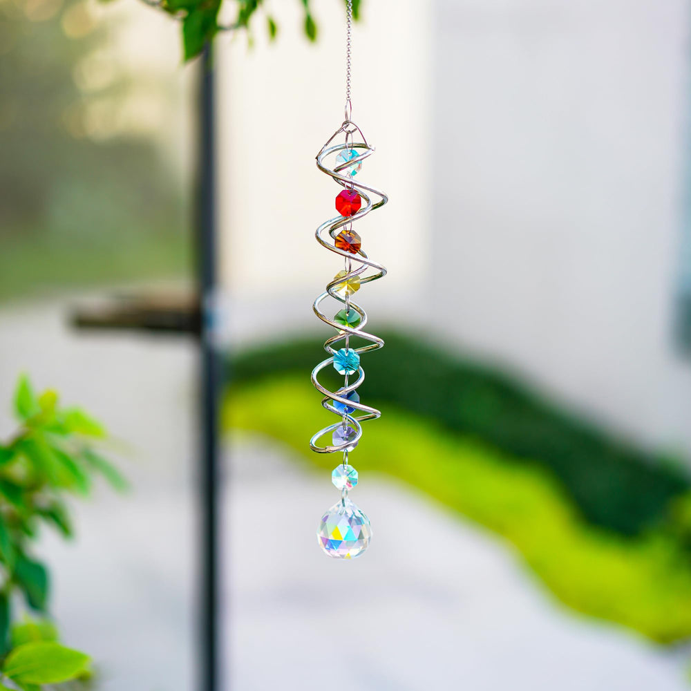 H&D HYALINE & DORA suncatcher with chakra beads in sunlight