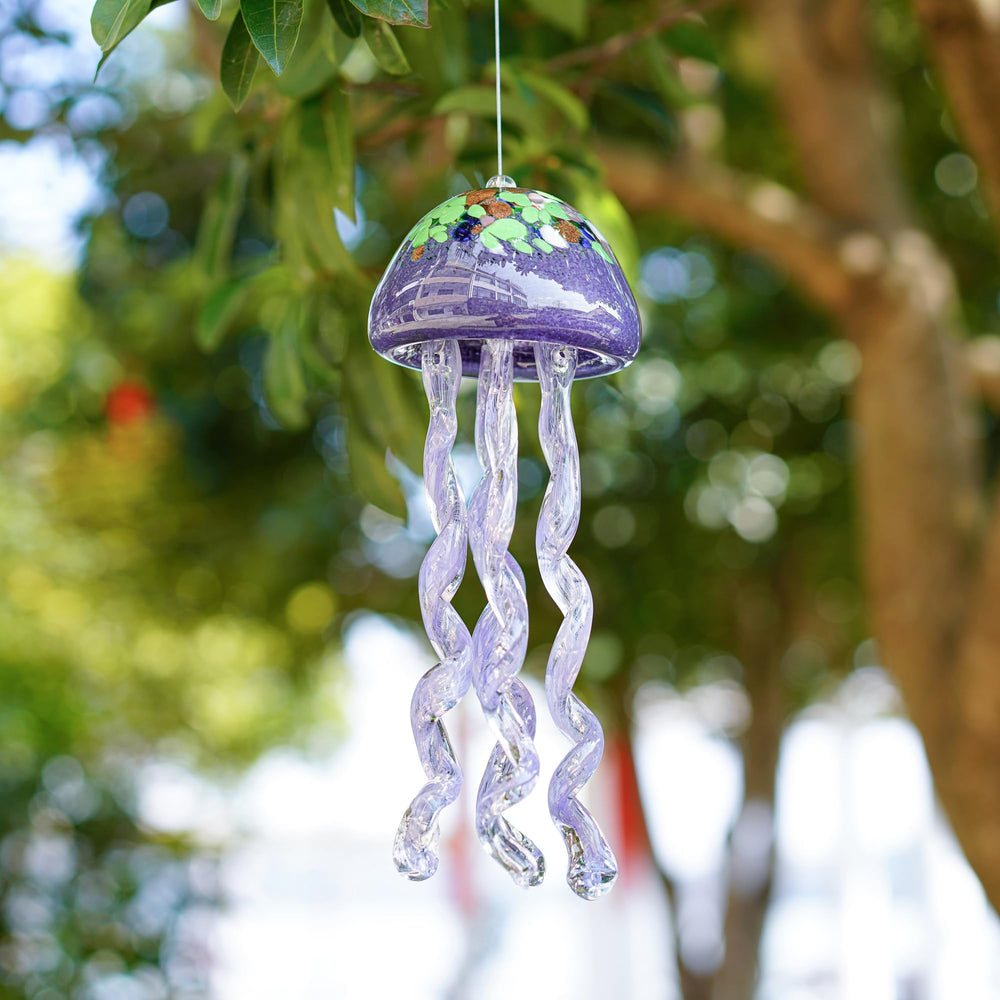 H&D HYALINE & DORA wind chime hanging in a garden setting