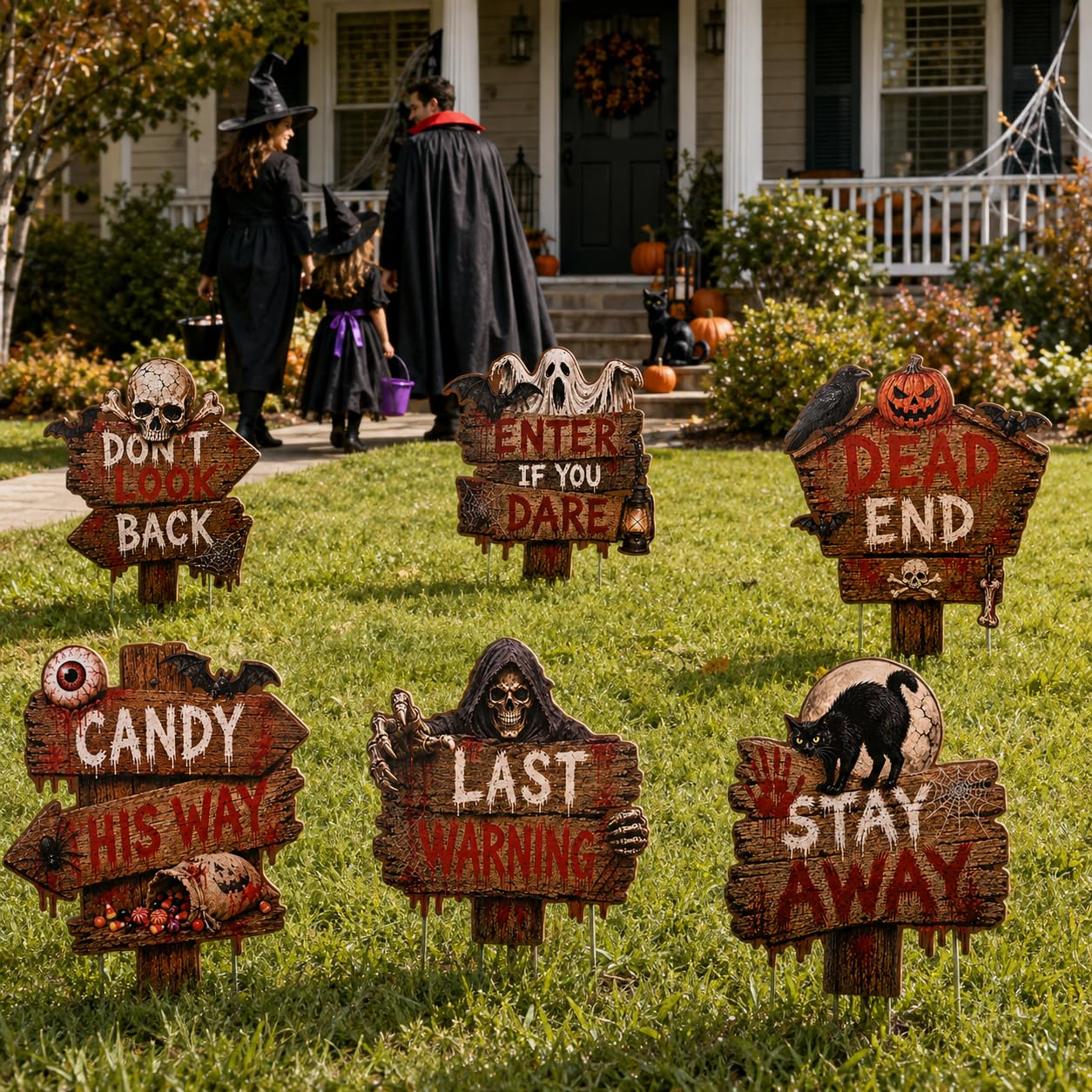 Halloween yard signs arranged along a pathway