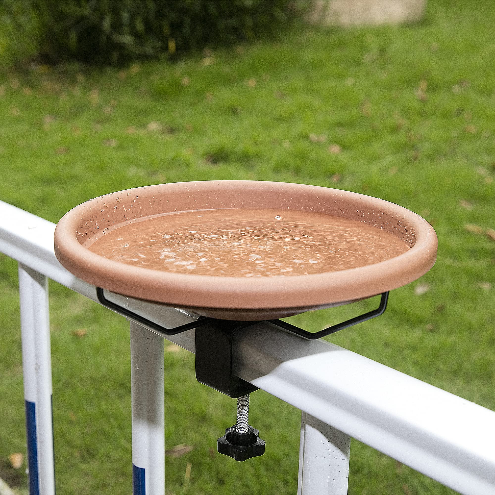 Hanizi Bird Bath being cleaned in a garden
