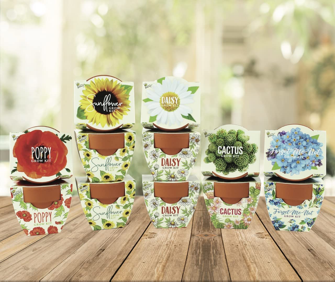 Happy child planting seeds from the BUZZY Daydream Grow Kit