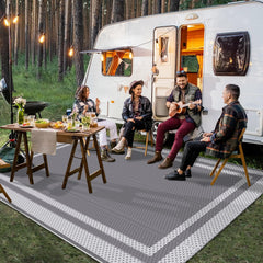 HappyTrends Outdoor Rug 5' x 8' placed in a garden setting
