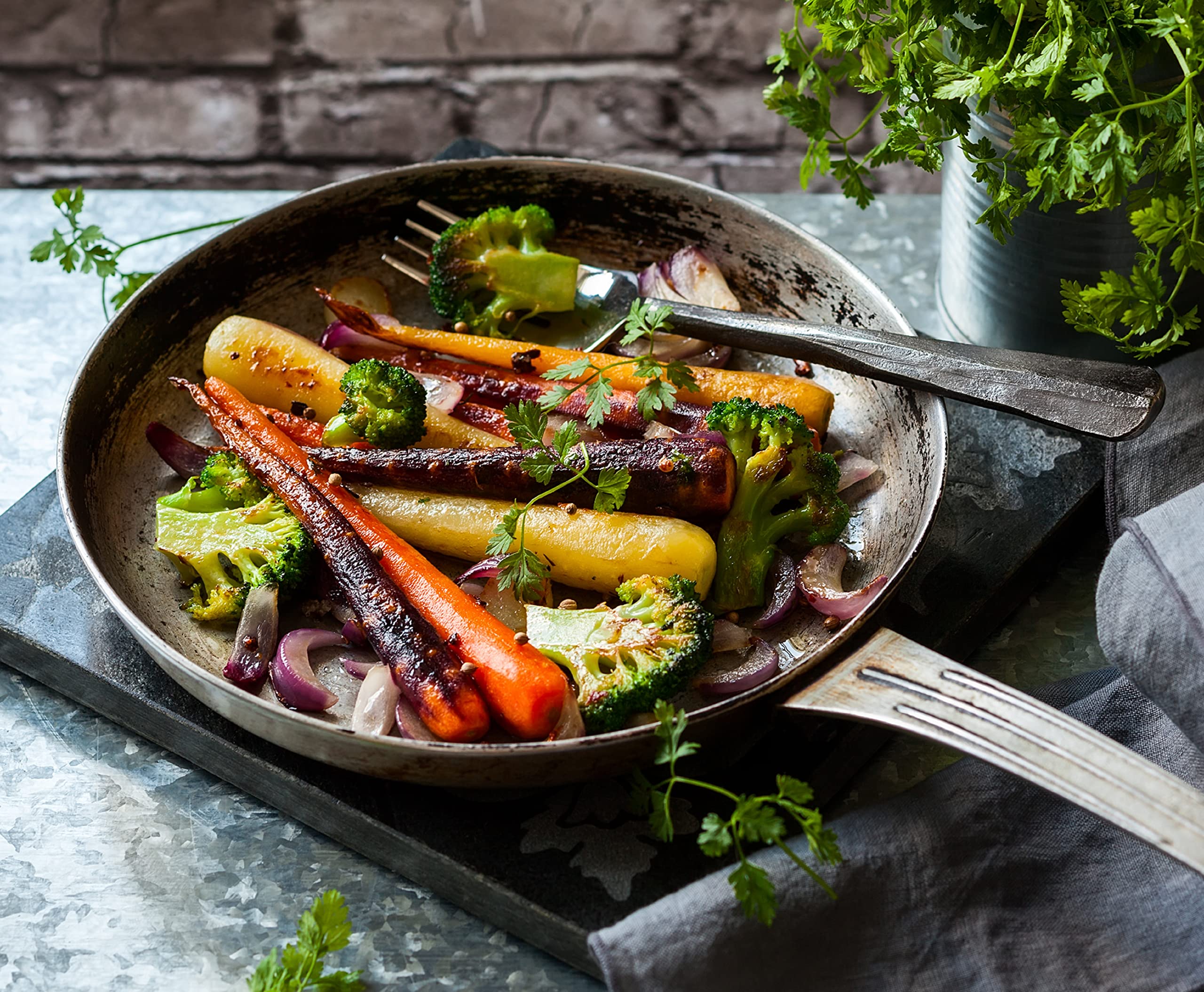 Harvested rainbow carrots in a basket