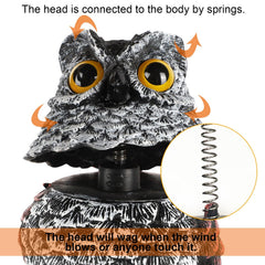 Hausse owl decoys placed in a garden setting