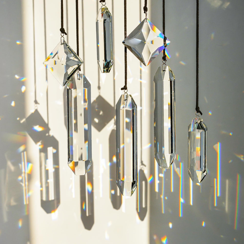 HDCRYSTALGIFTS Suncatchers hanging in a window with sunlight