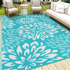HEBE 9' x 12' floral reversible outdoor rug in teal
