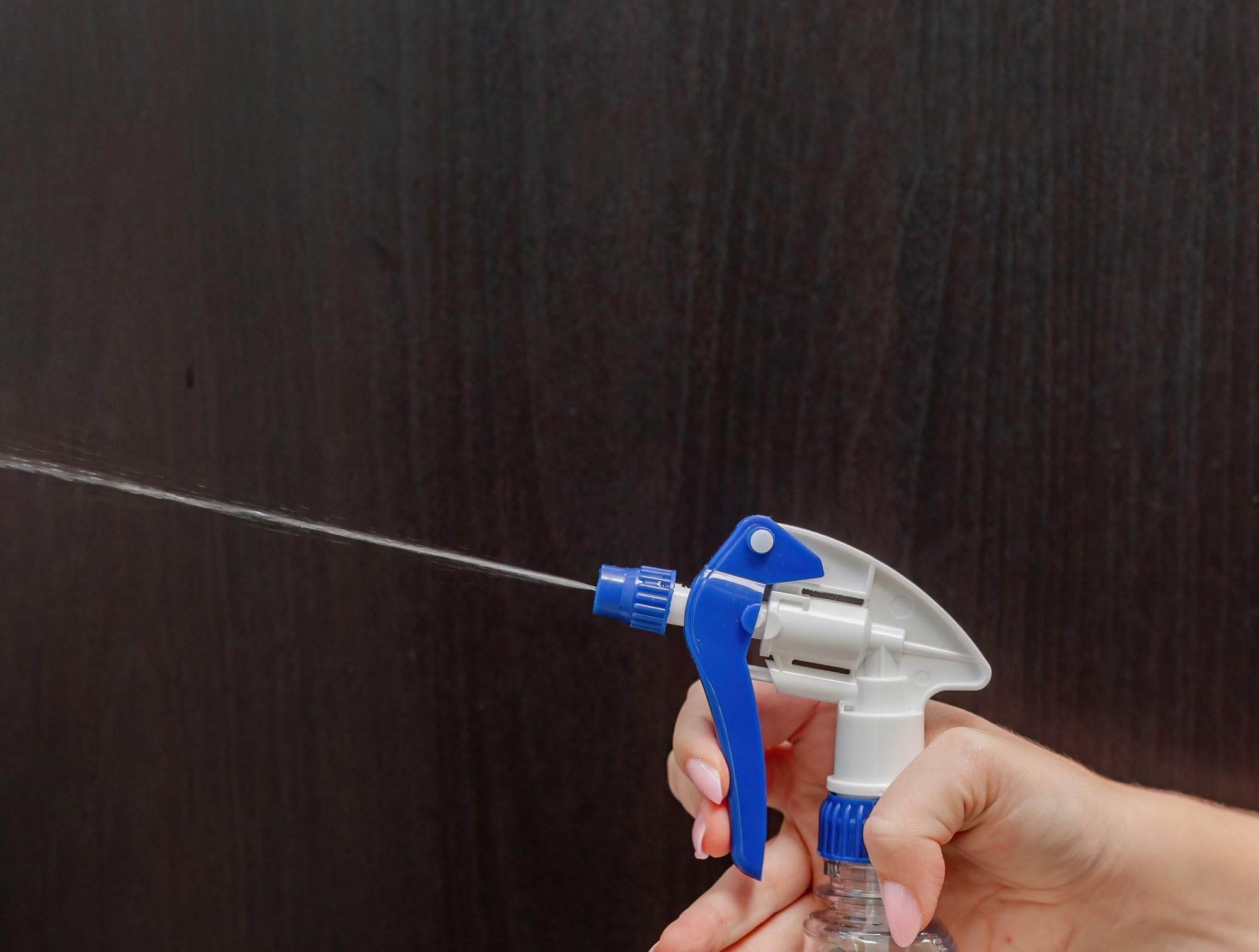 Heluva Green spray nozzle attached to a standard spray bottle