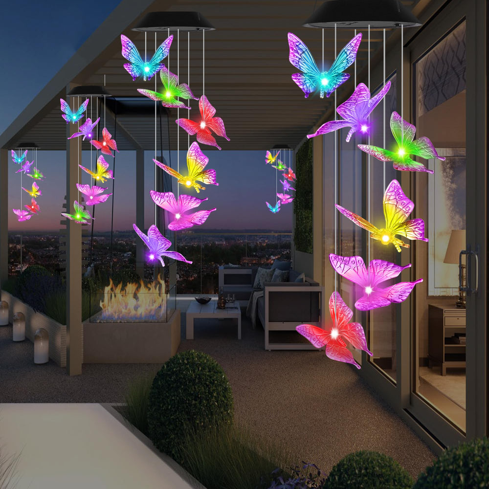 HiSolar Purple Butterfly Solar Wind Chimes in a decorative garden setting