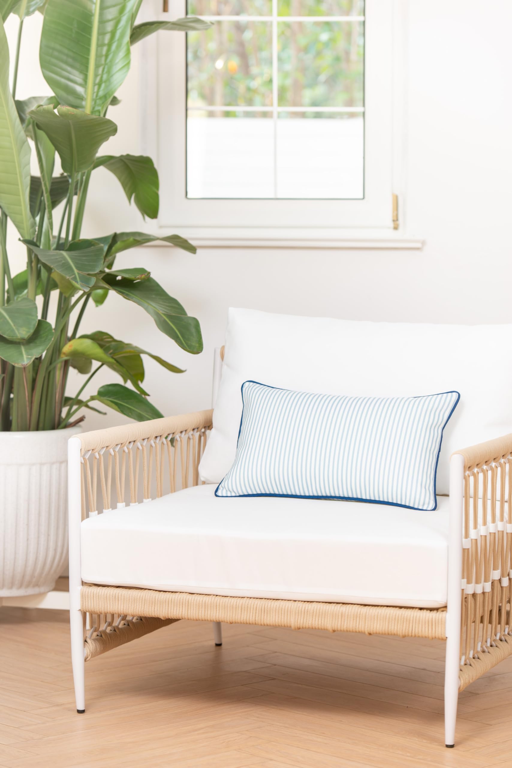 Hofdeco lumbar pillow cover displayed on a patio bench