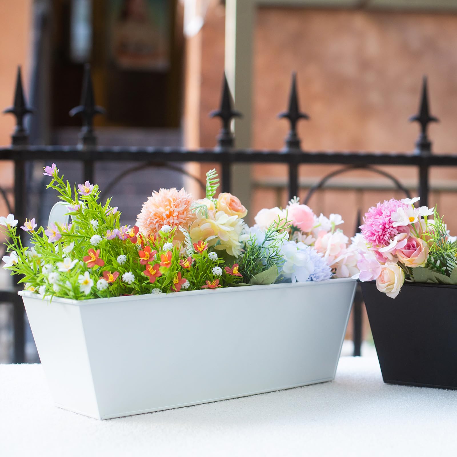 Holensun planter installed on a balcony wall with herbs