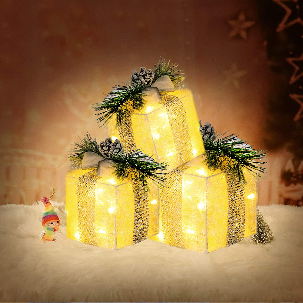 Hourleey lighted gift boxes arranged around a Christmas tree