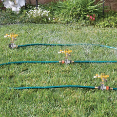 Hourleey sprinkler base installed in a garden bed