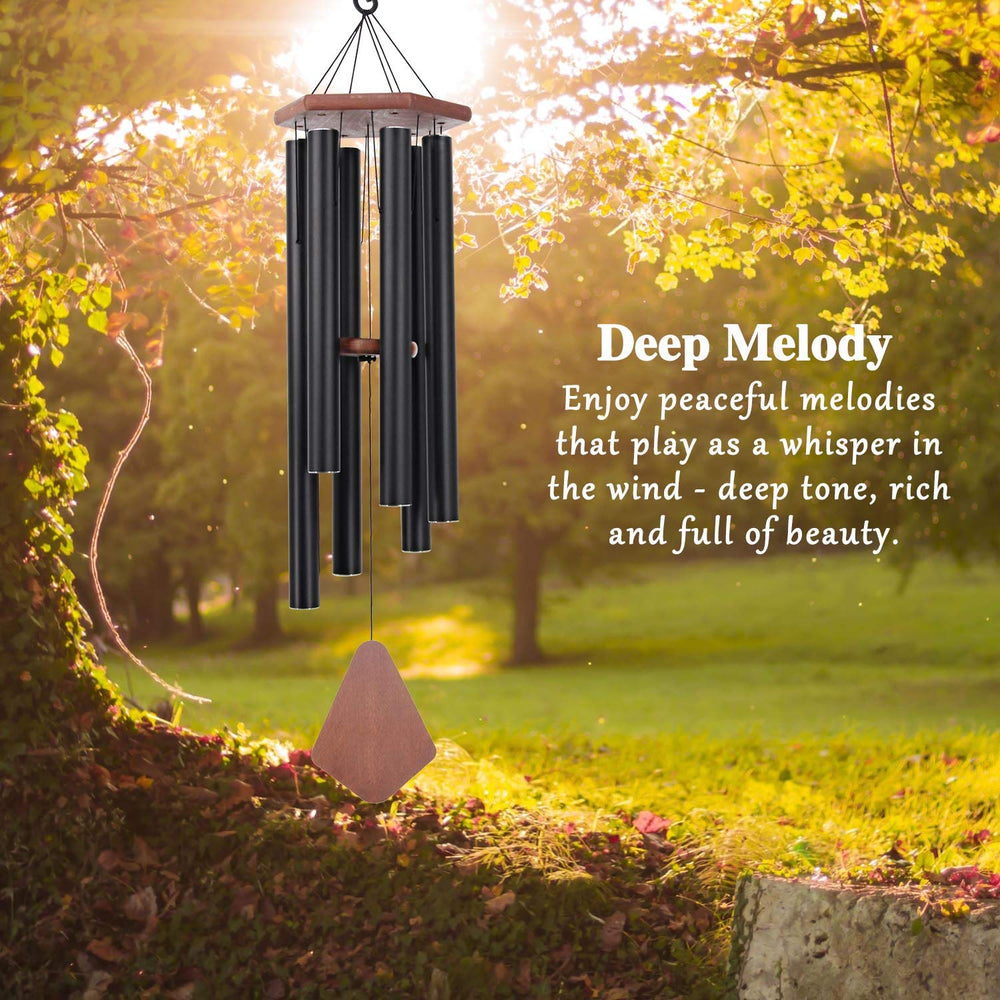 Howarmer wind chimes displayed on a porch with comfortable seating
