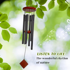 Howarmer wind chimes hanging in a garden setting
