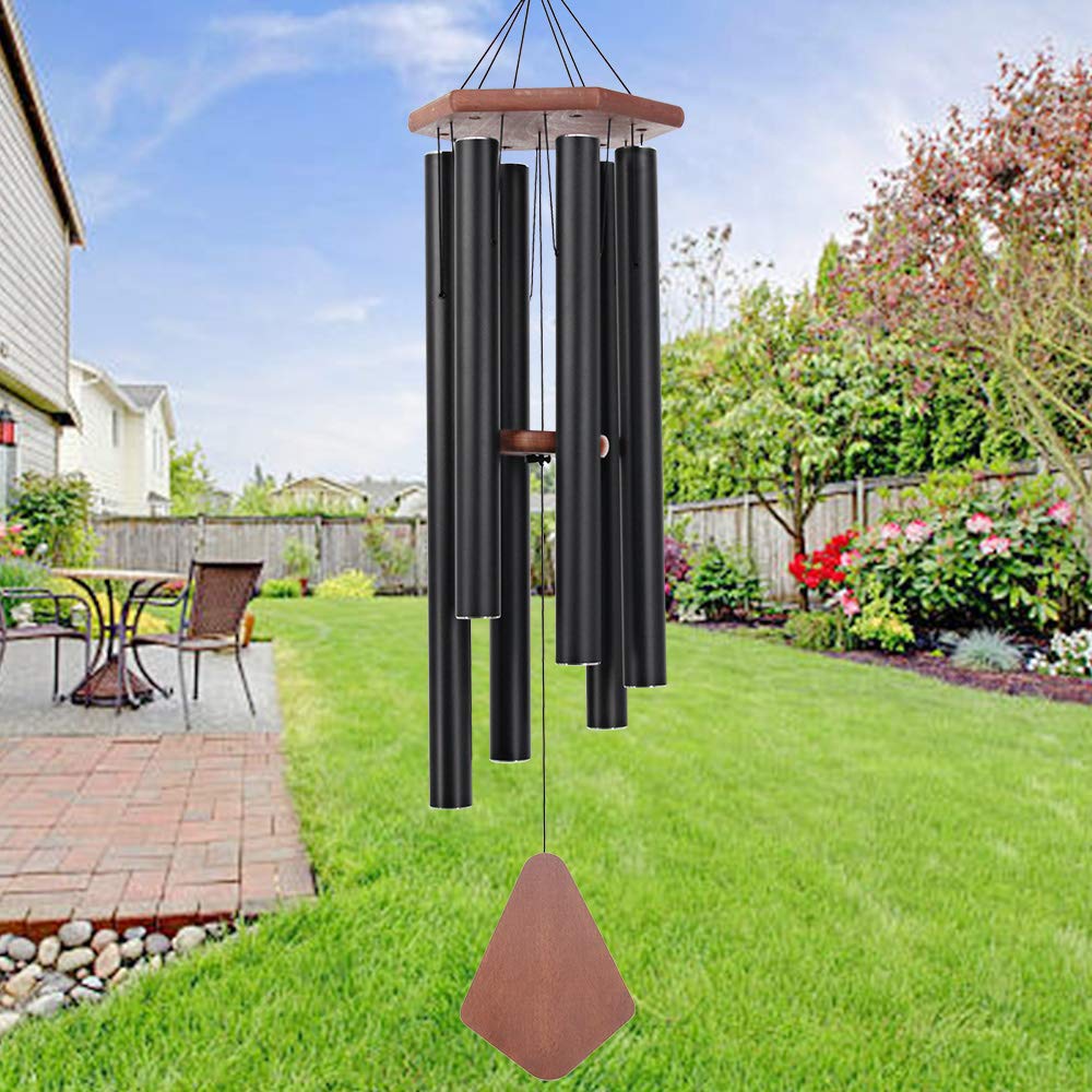 Howarmer wind chimes in a garden setting with flowers