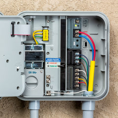 Hunter Pro-C controller mounted outdoors on a wall