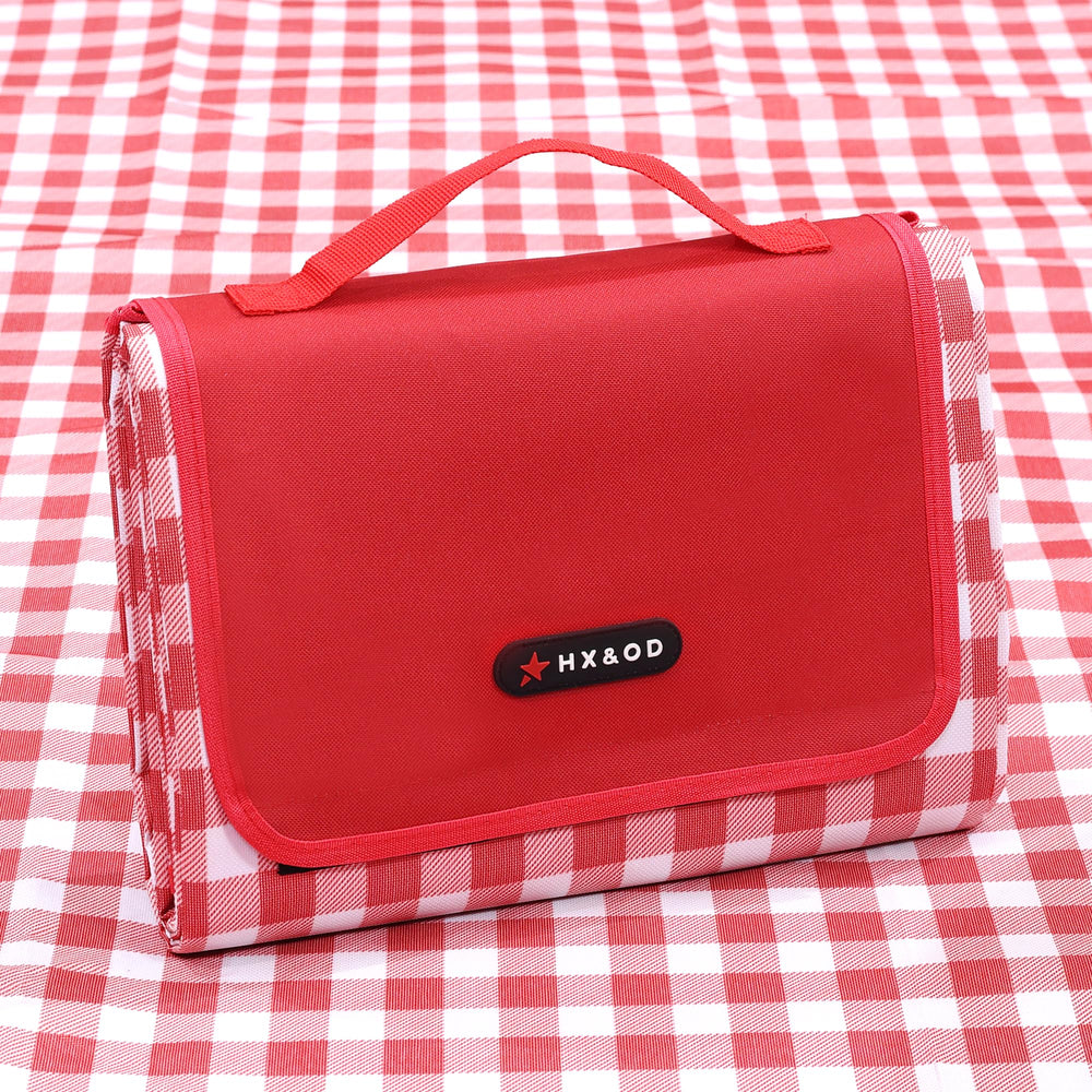 HX&OD Outdoor Picnic Blanket 80"x80" in red, rolled out on grass