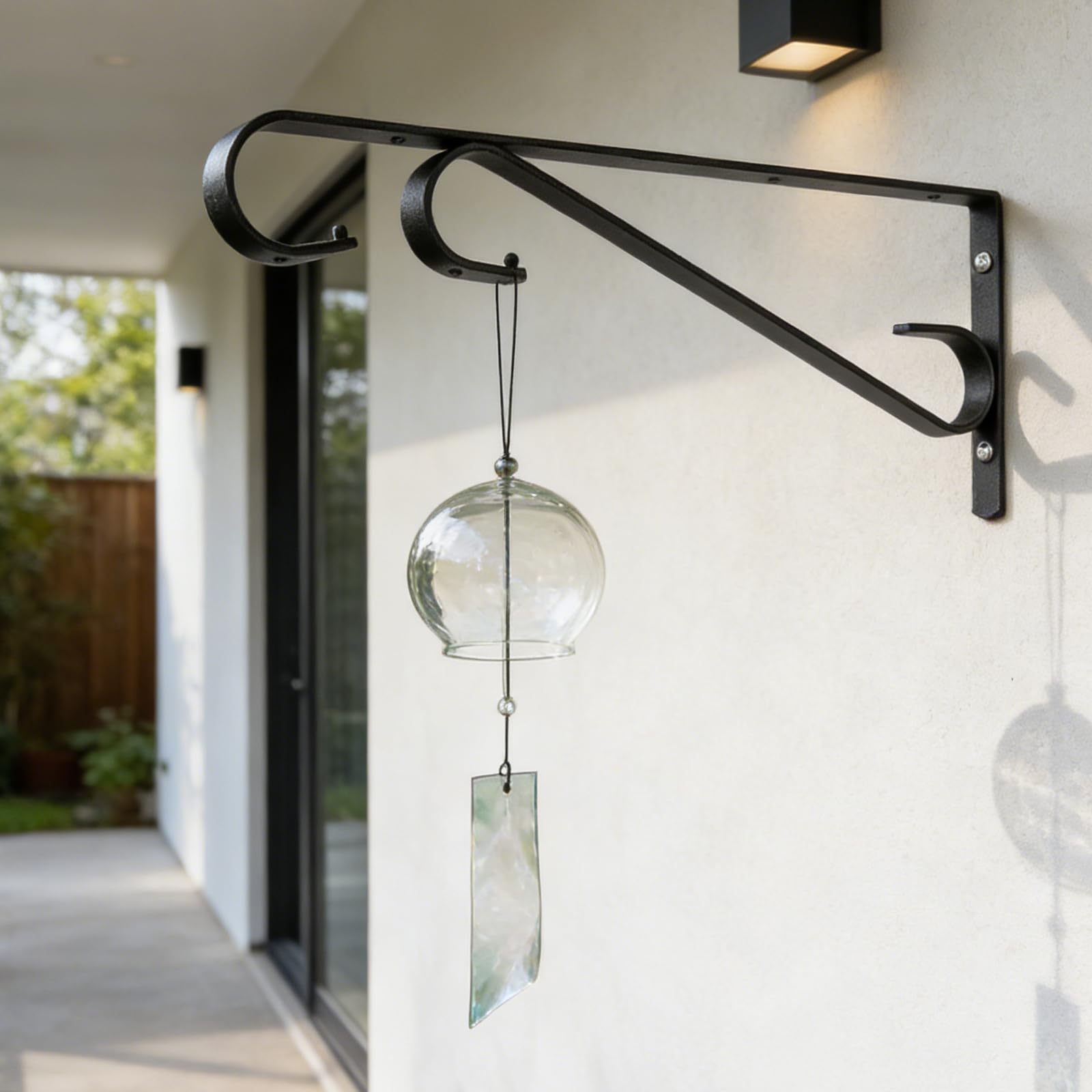 Hystun plant hangers in garden setting with flowers