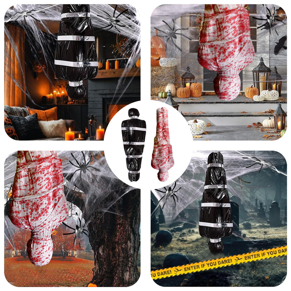 Inflatable corpse hanging from a tree with spider web