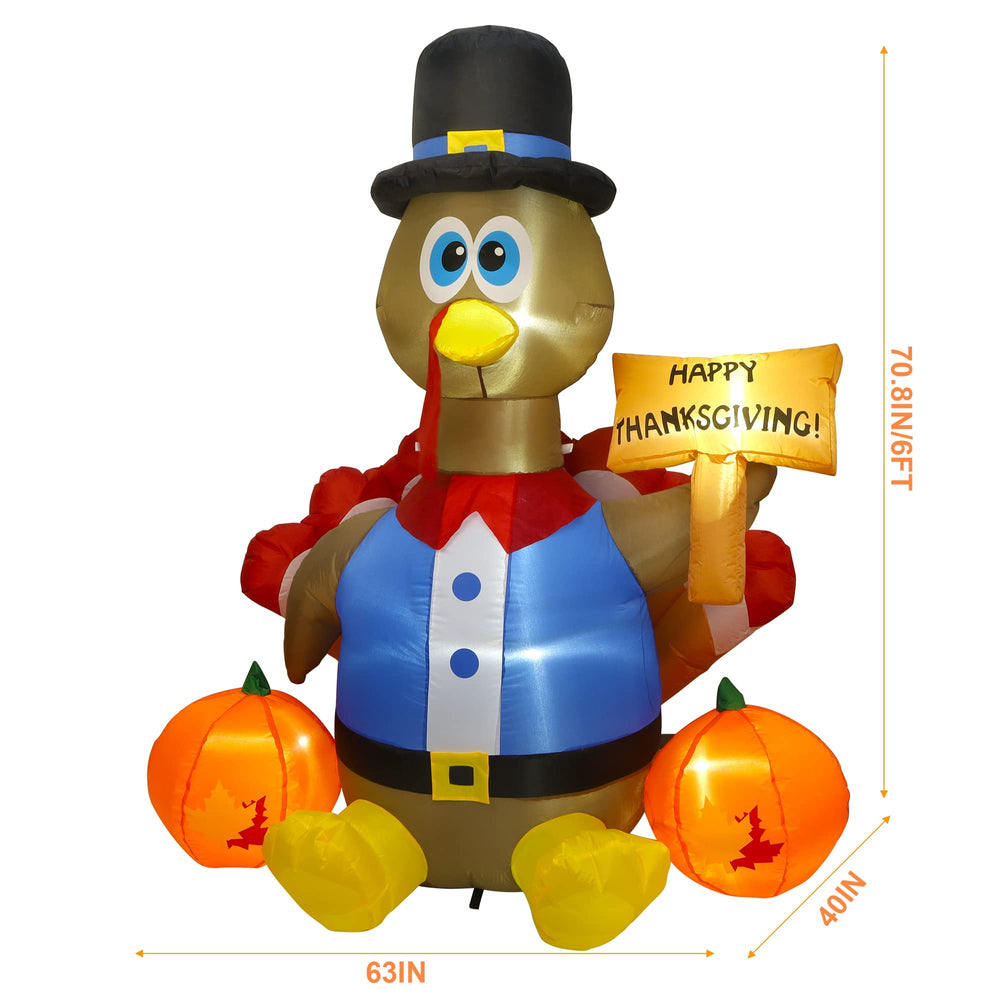 inflated turkey holding Happy Thanksgiving sign with pumpkins