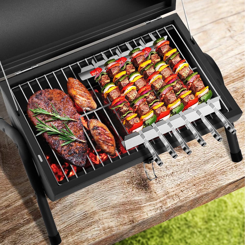 Inside view of DNKMOR Portable Charcoal Grill with cooking grid