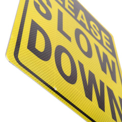 Installation of Kichwit Slow Down Sign with metal stakes