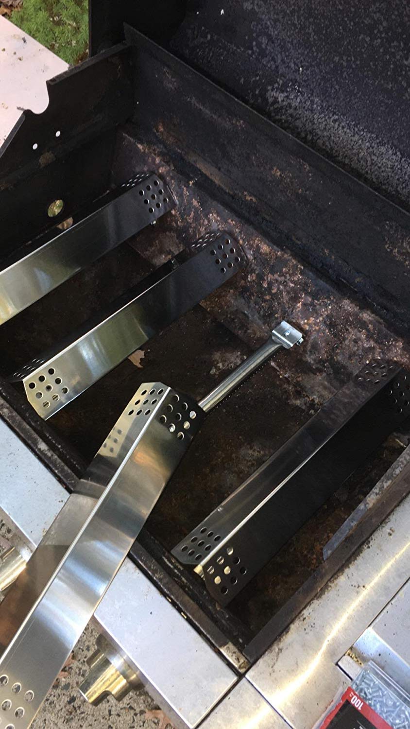 Installation view of Hisencn grill burners in a Master Forge grill