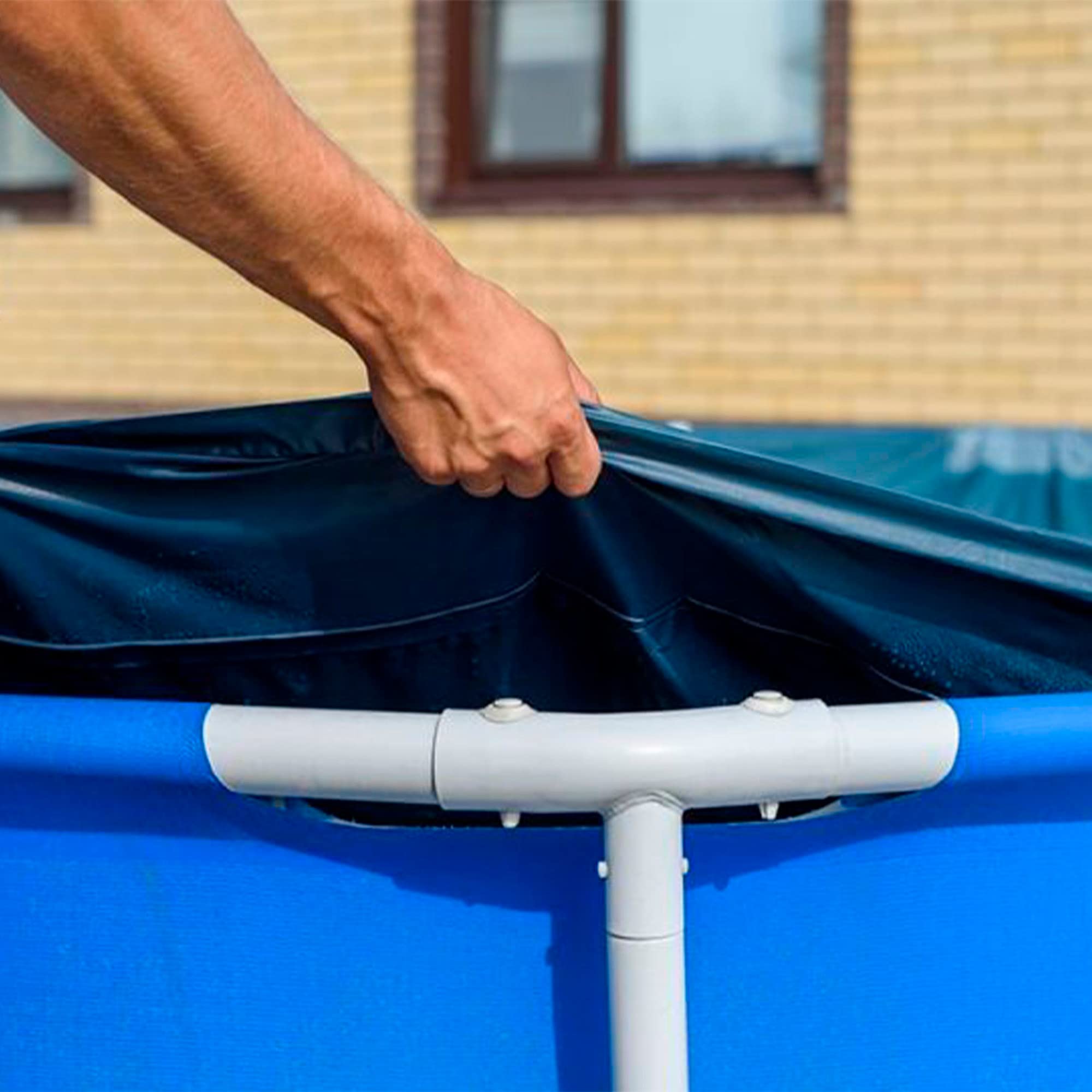 Intex 3m x 2m pool cover laid over a rectangular pool