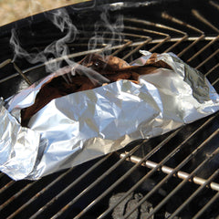 JACKDANIEL'S Wood BBQ Smoking Chips in a grilling setup