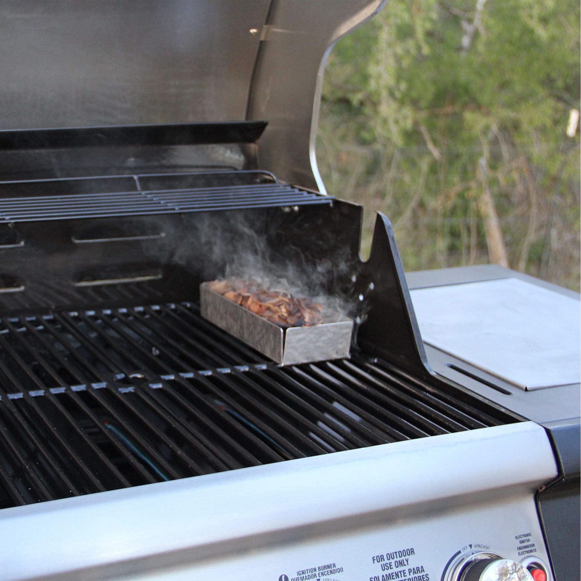 JACKDANIEL'S Wood BBQ Smoking Chips on a charcoal grill