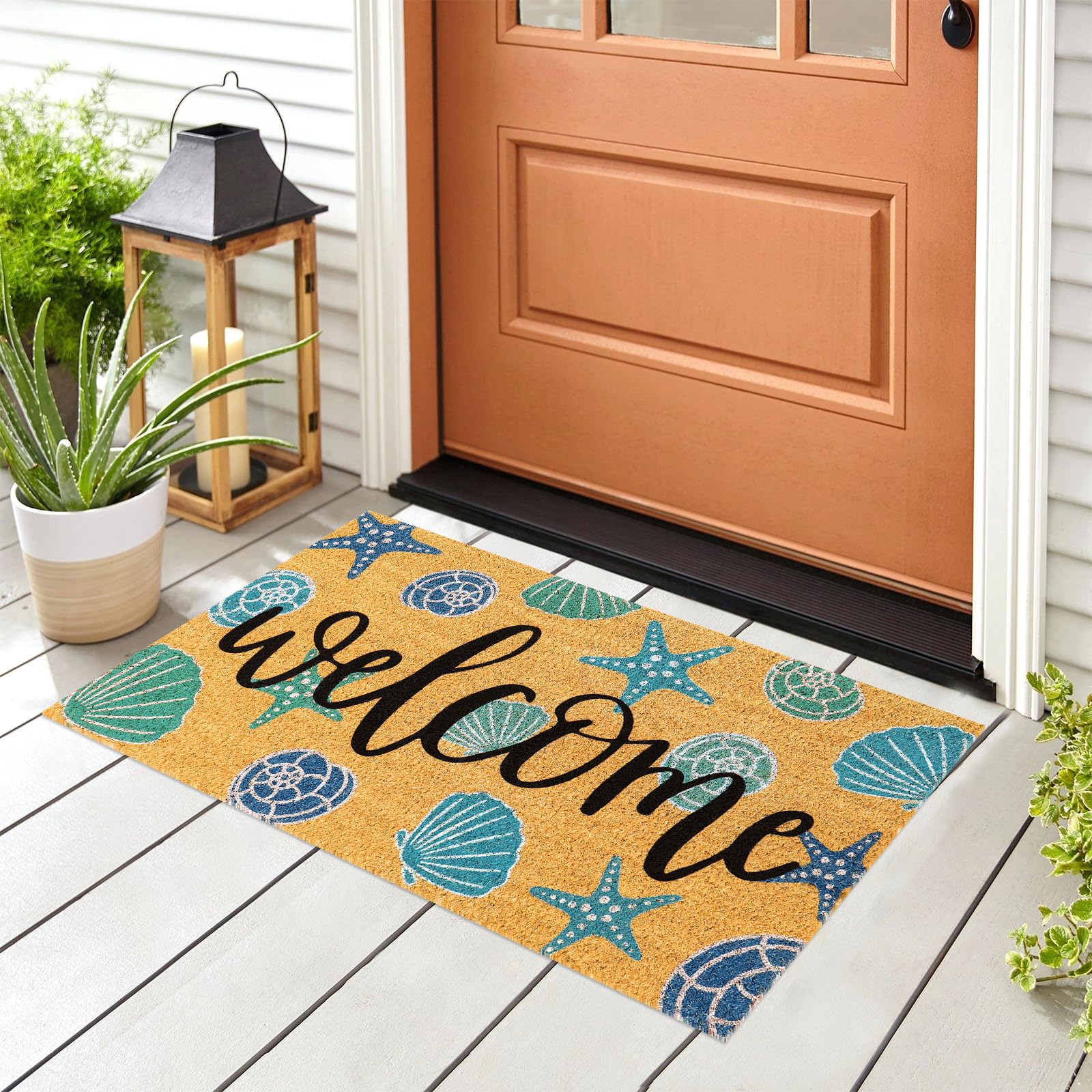 JarThenaAMCS Seashell Coir Door Mat in outdoor setting