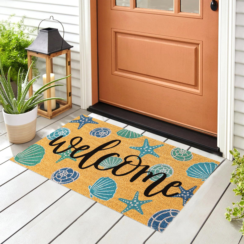 JarThenaAMCS Seashell Coir Door Mat in outdoor setting