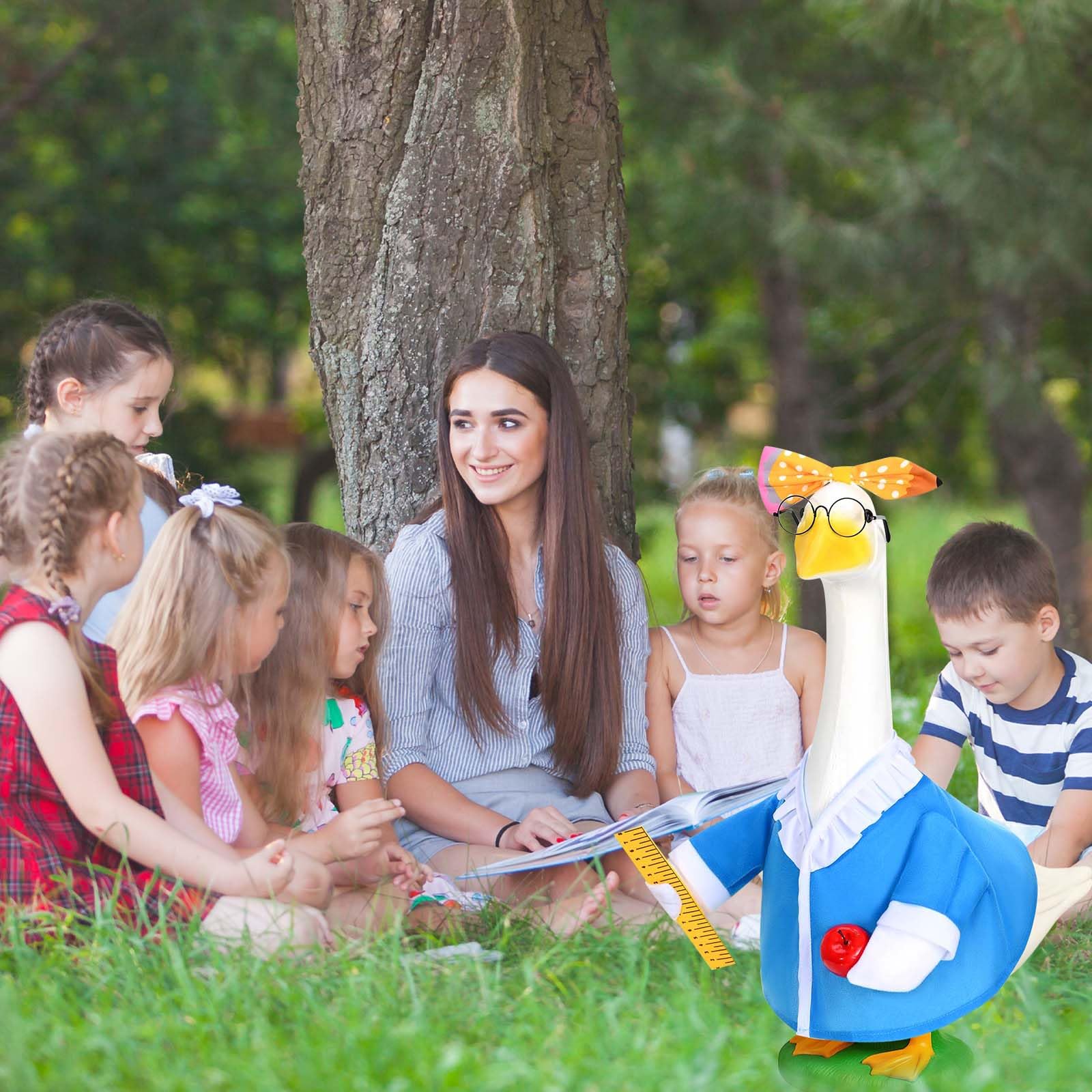 JcHrmers Teacher Goose Outfit on a garden statue in a garden setting