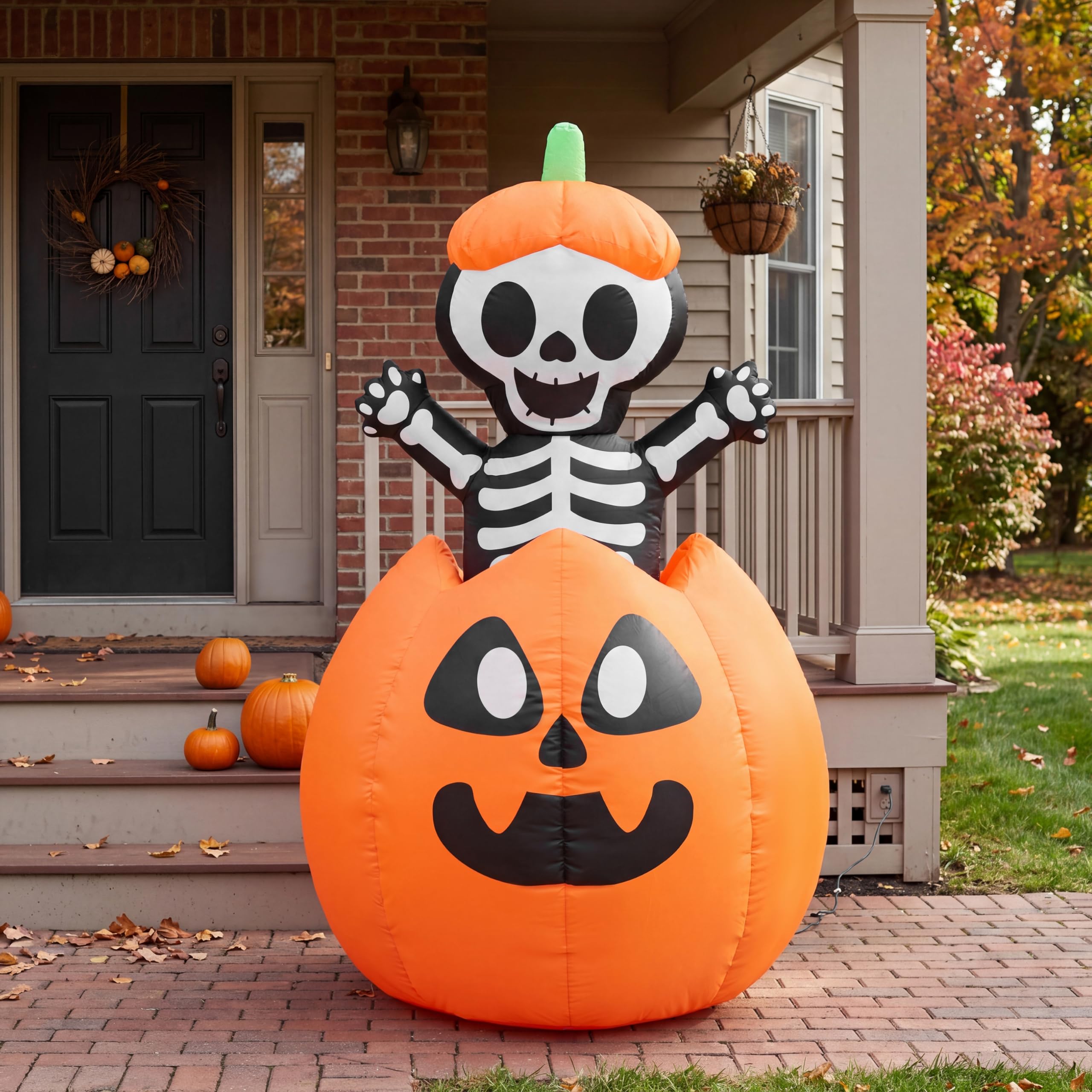 Joiedomi 5FT Halloween inflatable in yard with autumn leaves