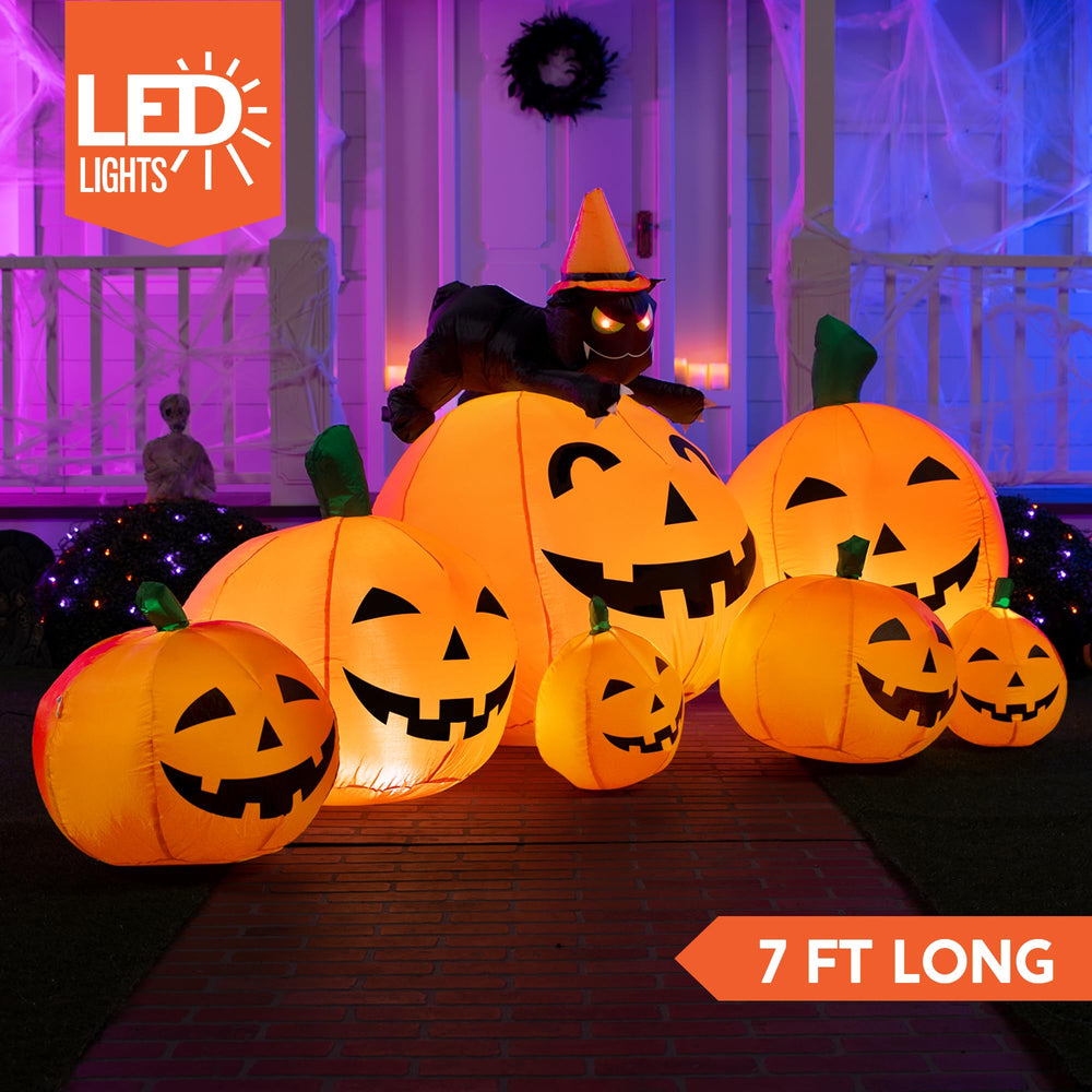 Joiedomi inflatable pumpkin displayed in a garden setting