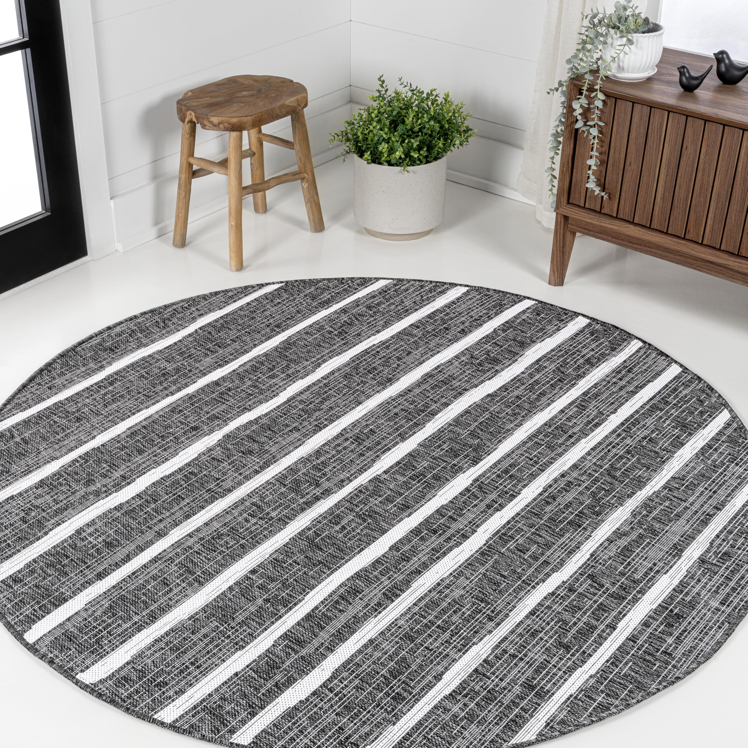 JONATHAN Y Berber Stripe Round Area Rug in outdoor setting