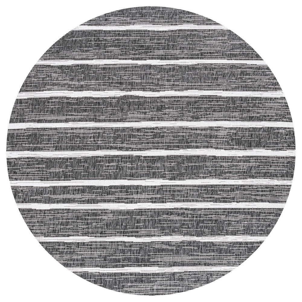 JONATHAN Y Berber Stripe Round Area Rug with furniture arrangement