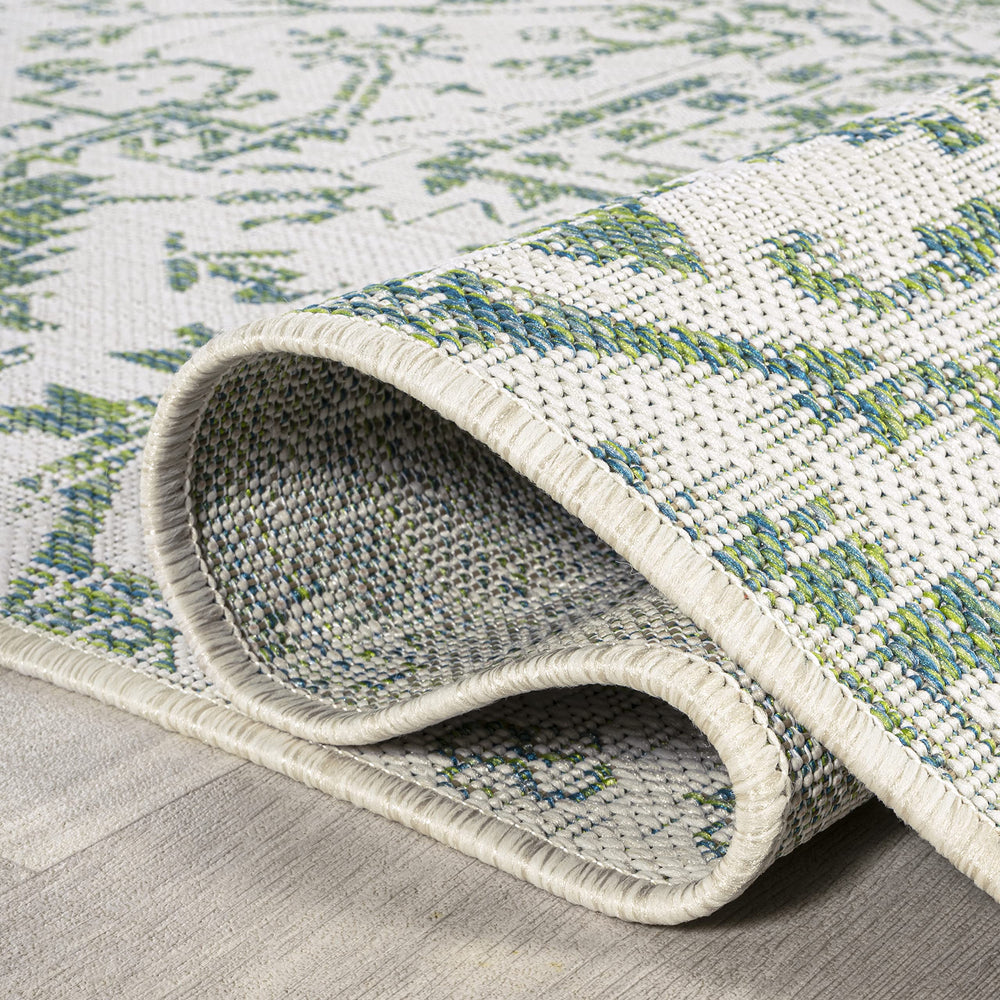 JONATHAN Y Boho Medallion Area Rug in a garden setting