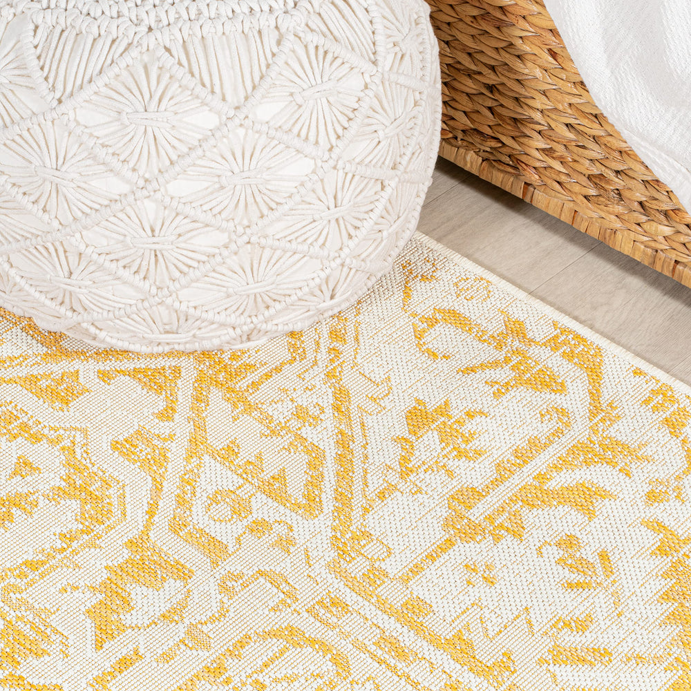 JONATHAN Y Boho Medallion Area Rug rolled up for storage