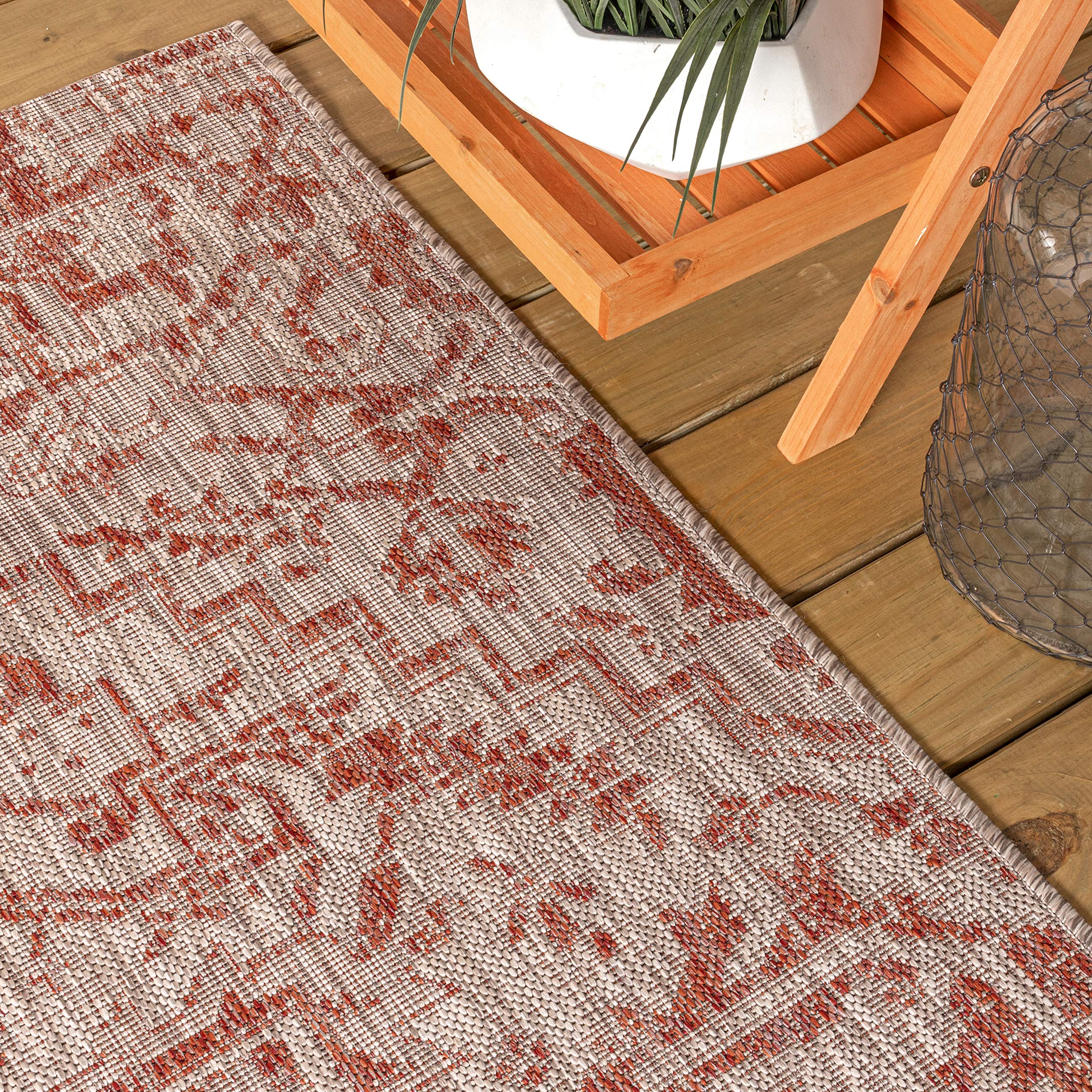 JONATHAN Y Boho Medallion Round Area Rug displayed in garden