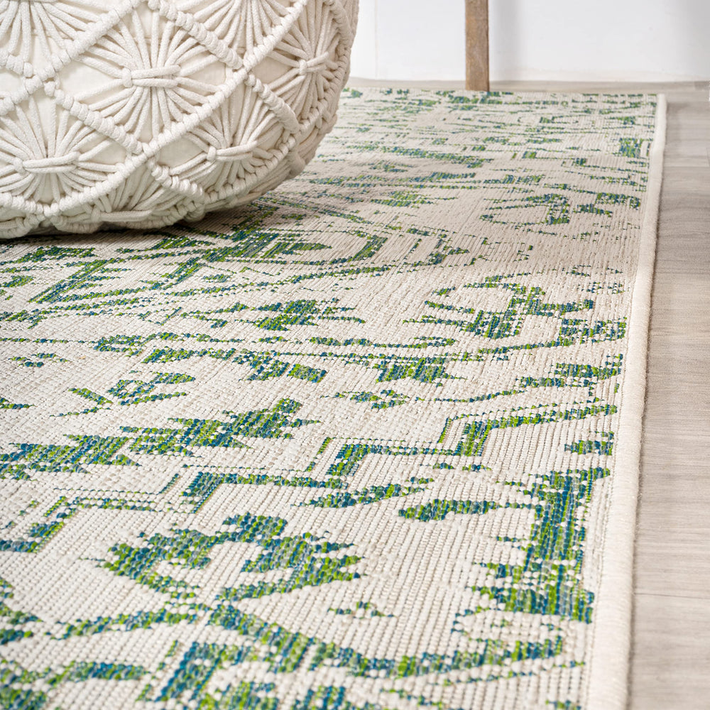 JONATHAN Y Boho Medallion Runner Rug rolled up for storage