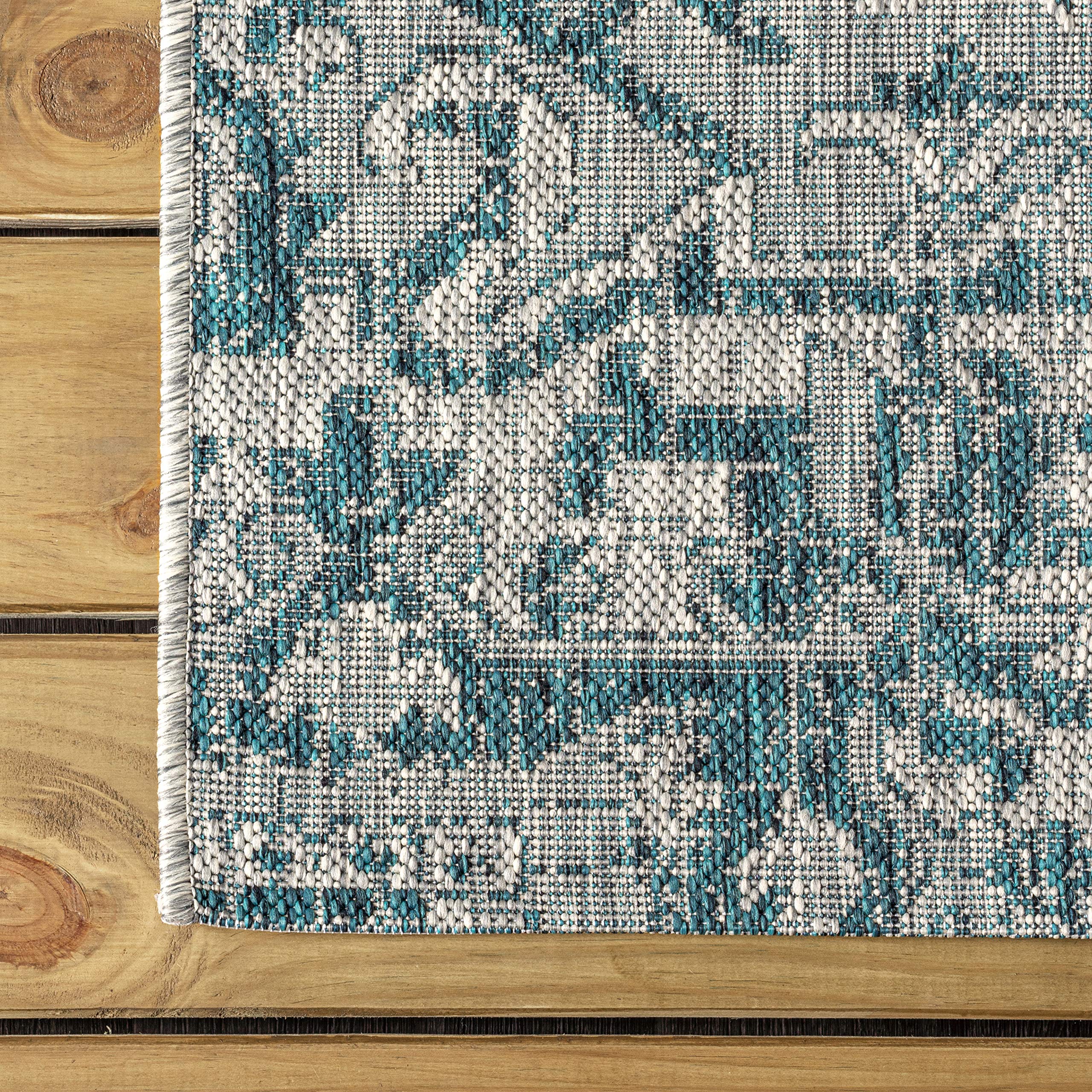 JONATHAN Y Boho Medallion Runner Rug rolled up for storage