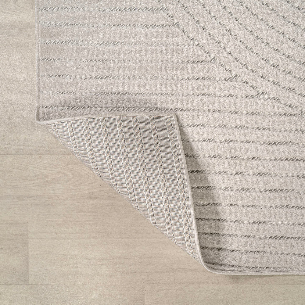 JONATHAN Y Hallie Rug displayed on a patio
