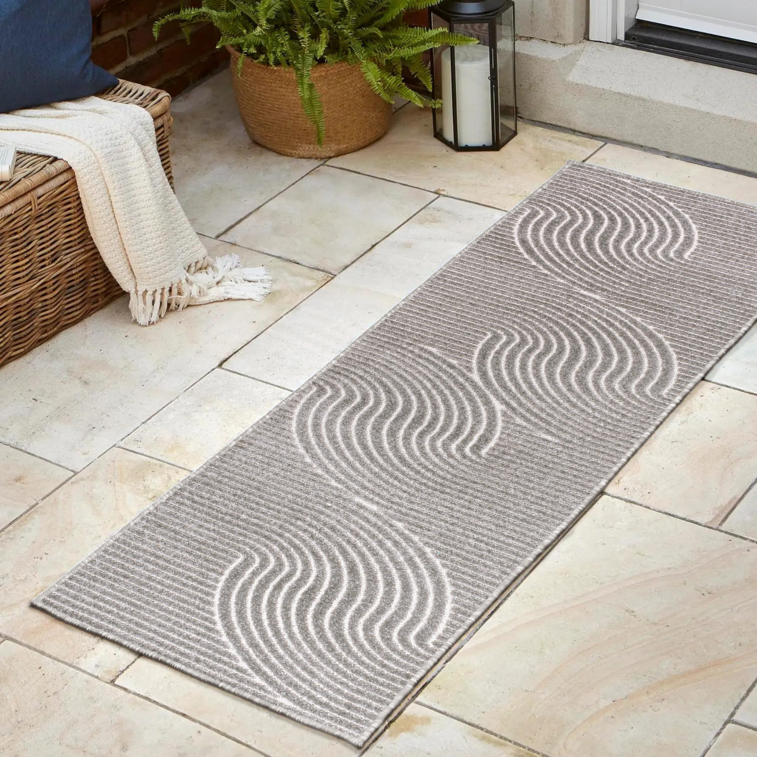 JONATHAN Y Hallie Runner Rug displayed on a porch
