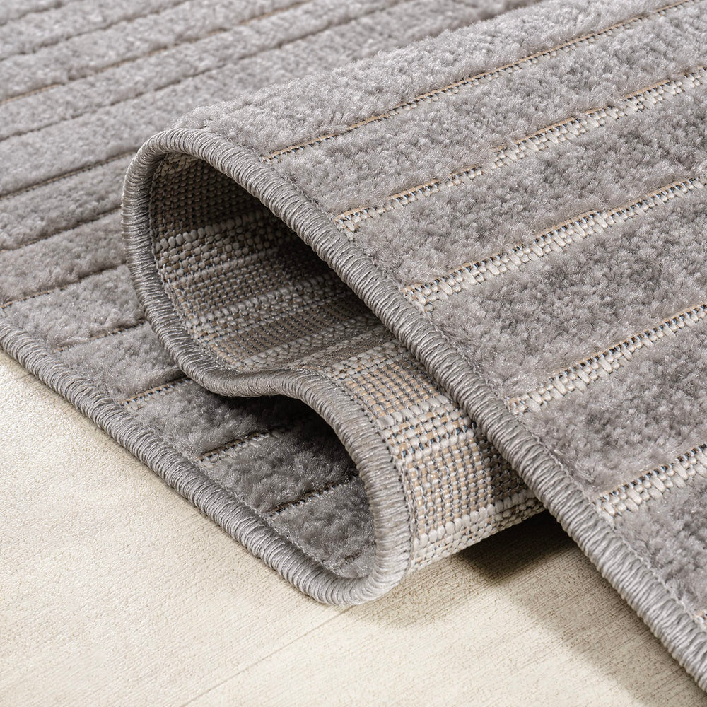 JONATHAN Y Hallie Runner Rug in a living room setting