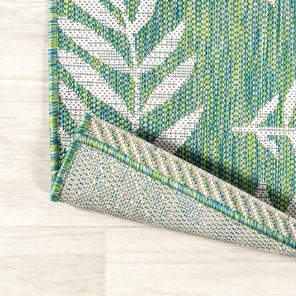 JONATHAN Y Palm Frond Area Rug in living room